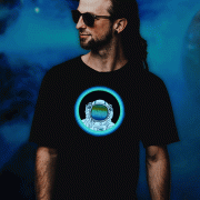 Man in dreadlocks wearing sunglasses and an astronaut equalizer light up shirt that animates to sound and music