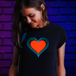 Brunette woman smiling looking down at her rainbow heart LED t-shirt animating to sound and music