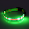 Green LED Dog Collar lighting up in dark room