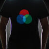Person wearing multicolor LED logo on black t-shirt