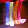 Four Flashion Statement Custom Engraved LED Bracelets on Wrist, Blue, White, Orange, pink