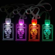 Four Star Wars themed custom engraved LED badges illuminating in white, pink, red and green