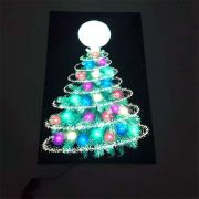 Christmas tree fully lit up on el poster in the dark