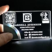 Construction logo on LED business card shining bright white