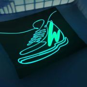 Shoe design with W lighting up brightly on EL panel