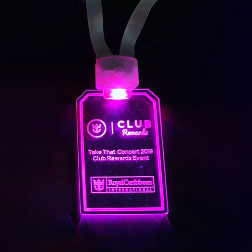 Royal Caribbean Custom LED Badge design lighting up very bright hot pink in dark setting