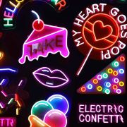 Wall of custom neon signs in bright colors with cake lips ice cream confetti sprinkles