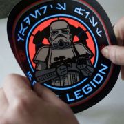 Storm trooper design on EL panel lighting up while someone bends the material