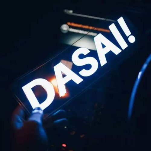 Dasai! lettering lighting up bright white on clear transparent backed EL panel