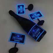 Light up wine label on champagne bottle with other extra EL panels surrounding the bottle