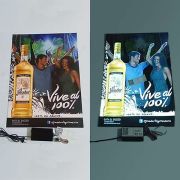 side by side showing a liquor poster advertisement