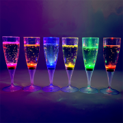 Six LED champagne flutes in a row lighting up bright colors pink, orange, blue, yellow, green and red