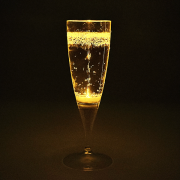 Yellow LED champagne glass lighting up bright yellow