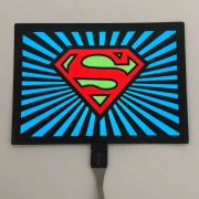 super man logo brightly lighting up on el panel design
