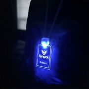 Close up of light up acrylic lanyard ID badges with custom logo