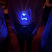 A man wearing a lanyard with a blue Lighted badge featuring Ikea branded logo