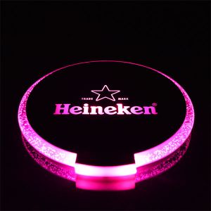 pink glowing light up coaster customized with Heineken logo