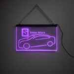 Purple LED edge-lit hanging sign engraved with Shine Worx logo and car outline