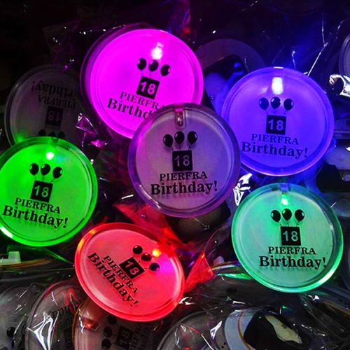 6 custom LED birthday pins for 18th party all lighting up different colors, pink, red, green, blue and one in the center turned off