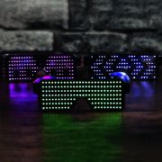 Three LED Sunglasses each lighting up a different animated pattern in a different LED color, from left to right hot pink, white and neon green