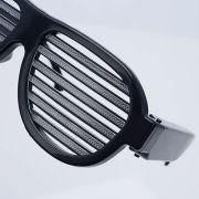 Close up of LED sunglasses shutter shades turned off showing hidden battery pack