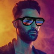 Good looking man wearing LED sunglasses shutter shades partially lit up