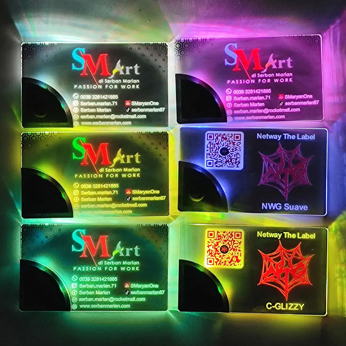 Six LED Business Cards lined up each illuminating a different neon color