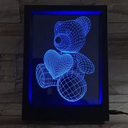 Picture frame showing lit up bear design in 3D form