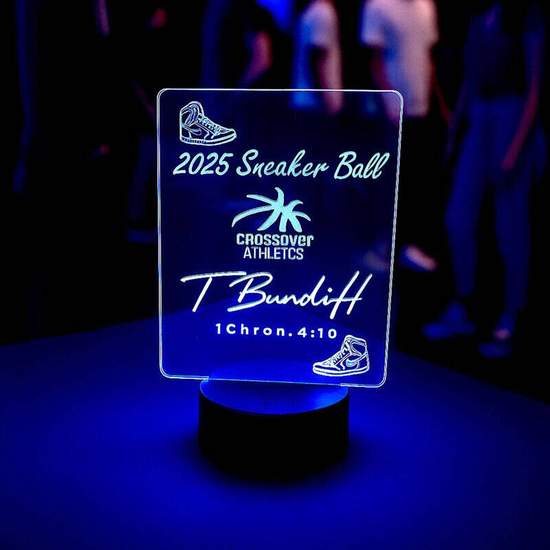 Custom engraved blue LED table sign for a sneaker event, battery-powered acrylic display with 2025 Sneaker Ball design