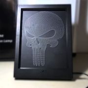 custom engraving of a skull on acrylic in a light up frame