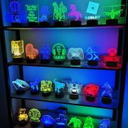 Four row display shelf full of custom acrylic led signs