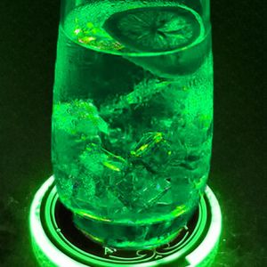 Custom LED coaster glowing neon green and making glass illuminate