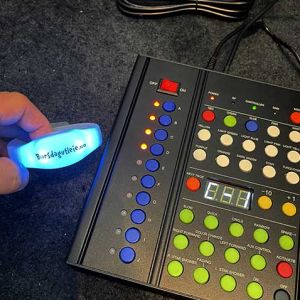 Customized LED bracelet next to 10 zone remote controller