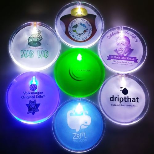 7 LED pins with different custom logos arranged in a flower shape each lighting up different colors