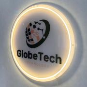 Technology company logo UV printed and lighting up through neon sign