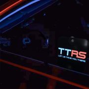TT ride share logo glowing on el car sticker window