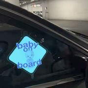 baby on board el sticker glowing on car window