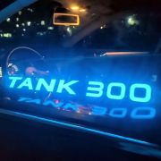 illuminated el car sticker with the words tank 300 glowing brightly on a car window