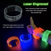 Pictures of laser engraving on clear TPU wristbands shown off and powered on glowing bright neon colors