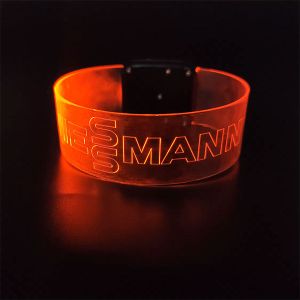 Veissmann logo lighting up on red LED wristband