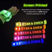 Screen printed led wristbands with "RYAN & GWEN" illuminating in different neon colors