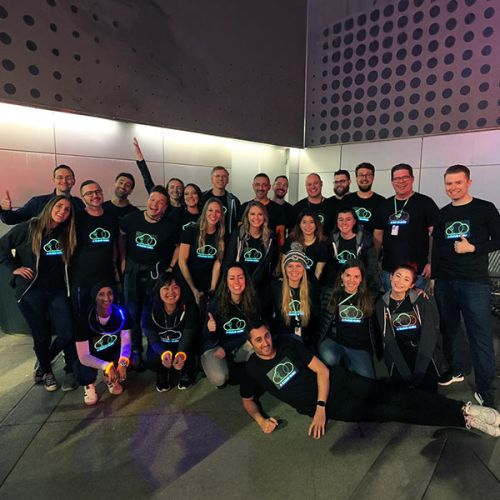 large group of colleagues wearing their company custom logo light up shirts