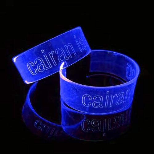 two glowing wristbands with custom engraved logo "cairain is 30"