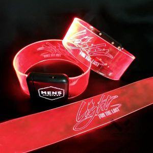 Three laser engraved led wristband design with "light for the lost" lighting up and a custom logo on the battery pack