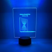 A blue LED lamp with "Galaxy Pro" written on it, glowing in a dark setting