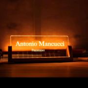 LED acrylic name plate featuring a custom name and title in an office