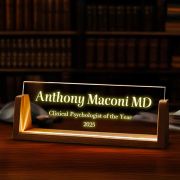 Warmly glowing desk lamp with "Clinical Psychologist of the Year" engraving, elegantly displayed on a table