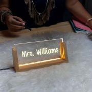 Personalized LED acrylic plaque with a teacher's name, designed as a unique desk sign gift for a teacher
