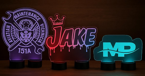 Custom-shaped illuminated acrylic signs demonstrating different engraving styles and multicolor LED bases
