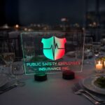 Public Safety Employees Insurance Inc. LED acrylic centerpiece sign illuminated on a formal gala dinner table
